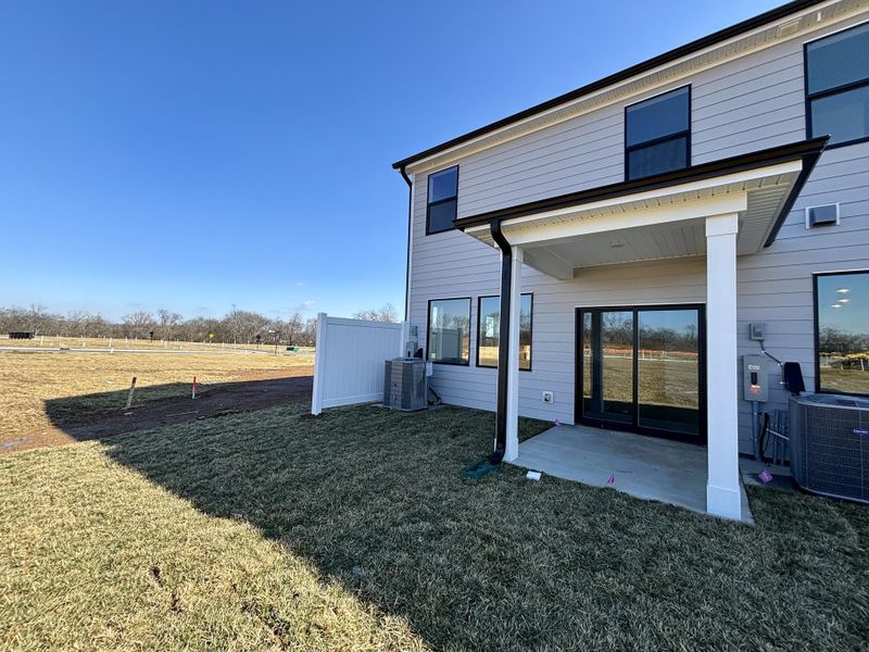 Exterior details and patio area of a home in Nexus Townhomes, Gallatin (Image 3).