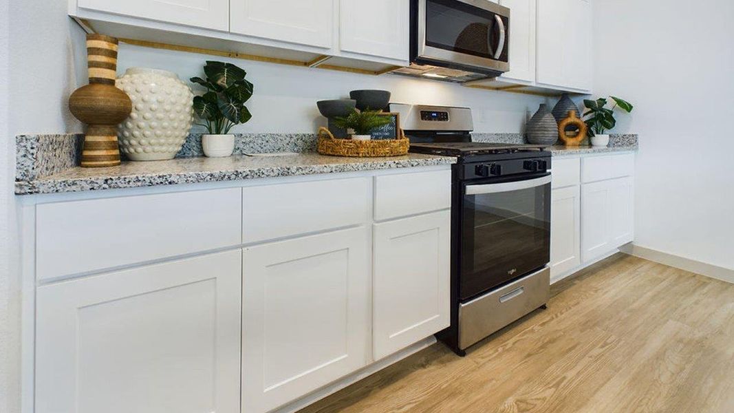 Representative furnished interior of a home built from the The Pierce by D.R. Horton in Overlook West, Wolfforth (Image 7).