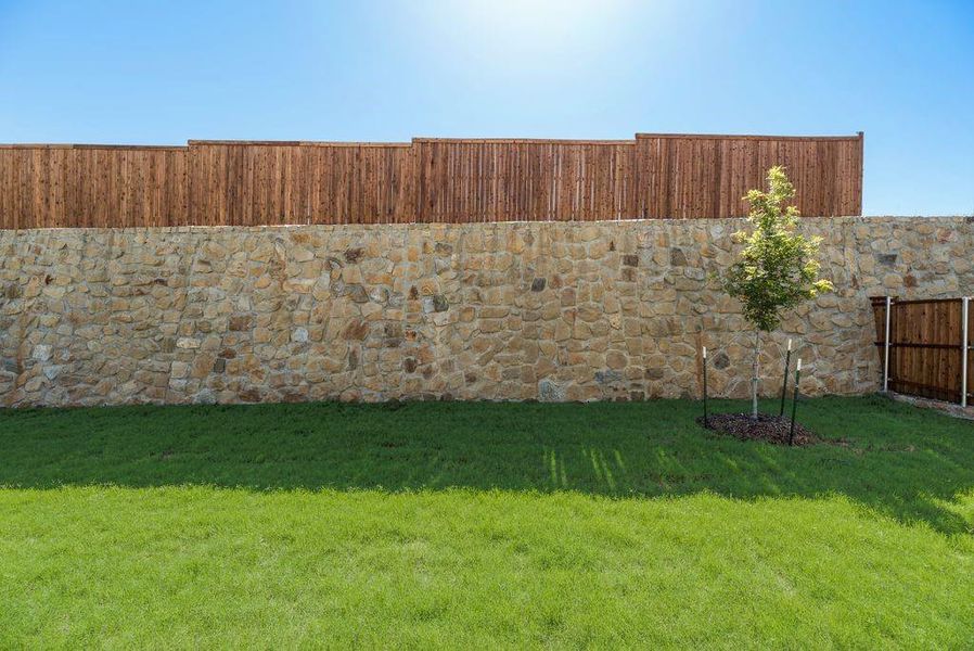 View of fenced backyard