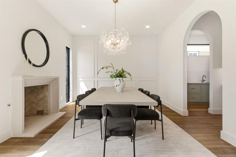 Designated dining with gas starting fireplace, access to kitchen & butler's pantry