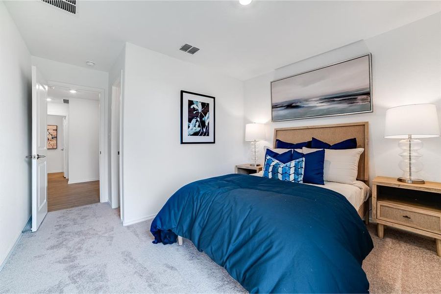 Carpeted bedroom with baseboards and recessed lighting Carpeted bedroom with baseboards and recessed lighting