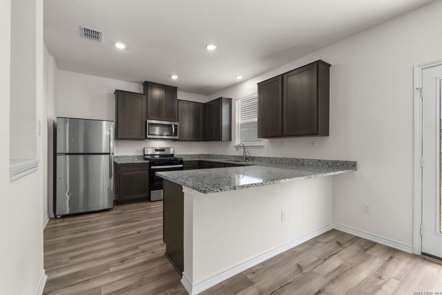 Furnished interior view inside a new home in Parklands, Schertz (Image 10).
