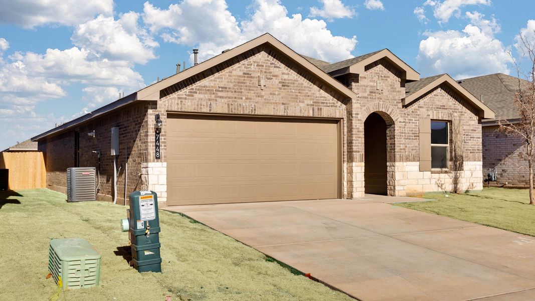 Front exterior of a new home in Terra Vista, Lubbock, TX, highlighting curb appeal (Image 15).