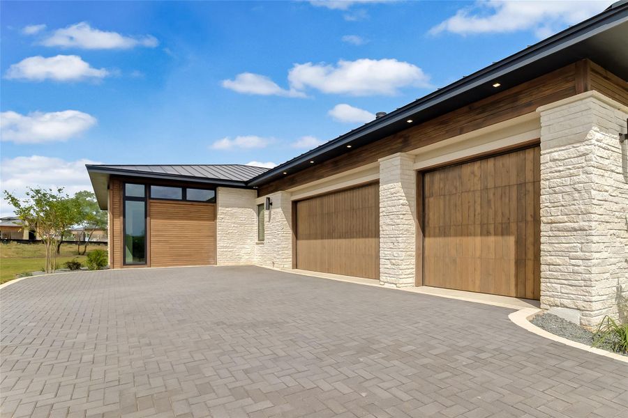 Garage with decorative driveway Garage with decorative driveway