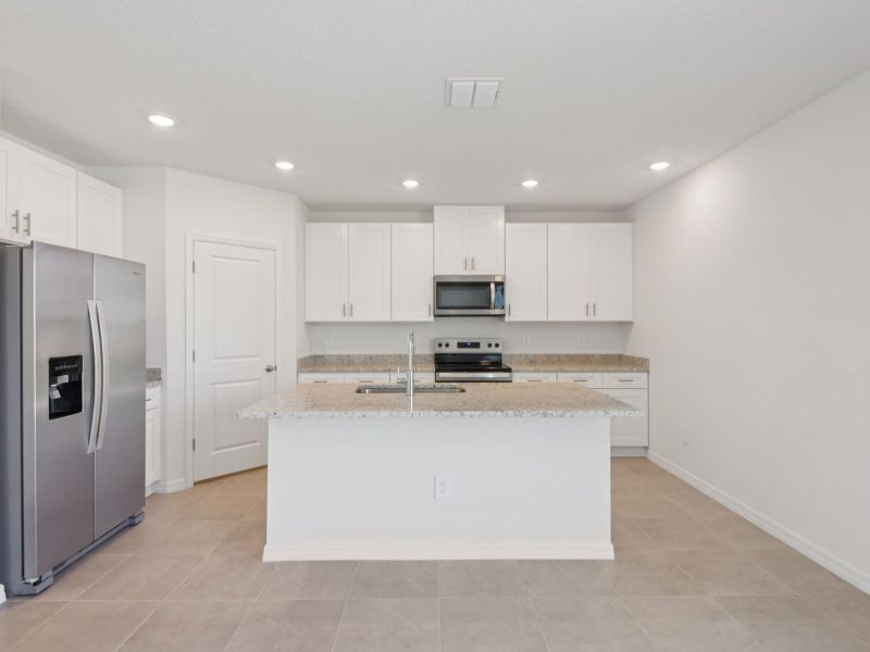 Furnished interior view inside a new home in Hilltop Vistas, Dade City (Image 6).