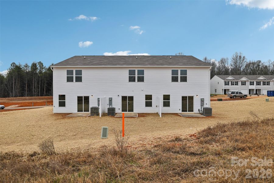 Exterior details and patio area of a home in The Towns at Green Needles, Lexington (Image 3).