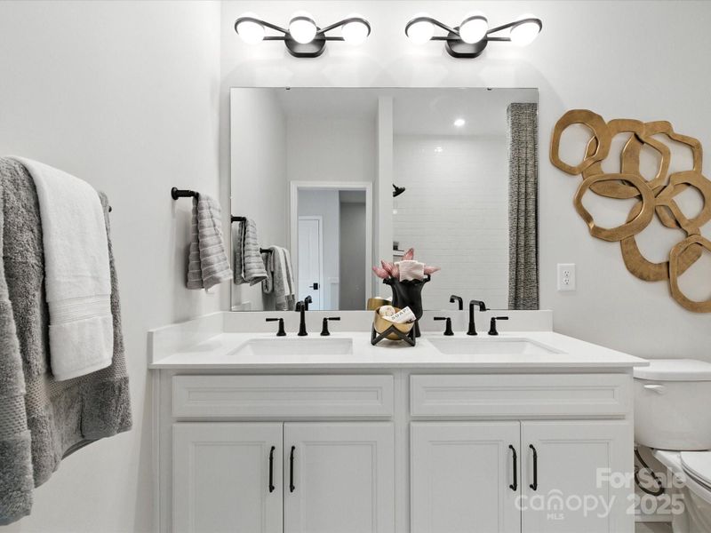 Dual Vanity at Secondary Bedroom with Loads of Storage Space. *Model Photos | Actual Finishes, Structural Selections, and Orientation May Vary.