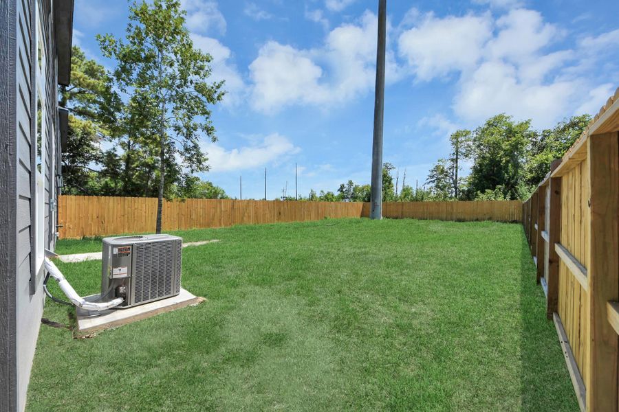 Exterior details and patio area of a home in , Huffman (Image 4).