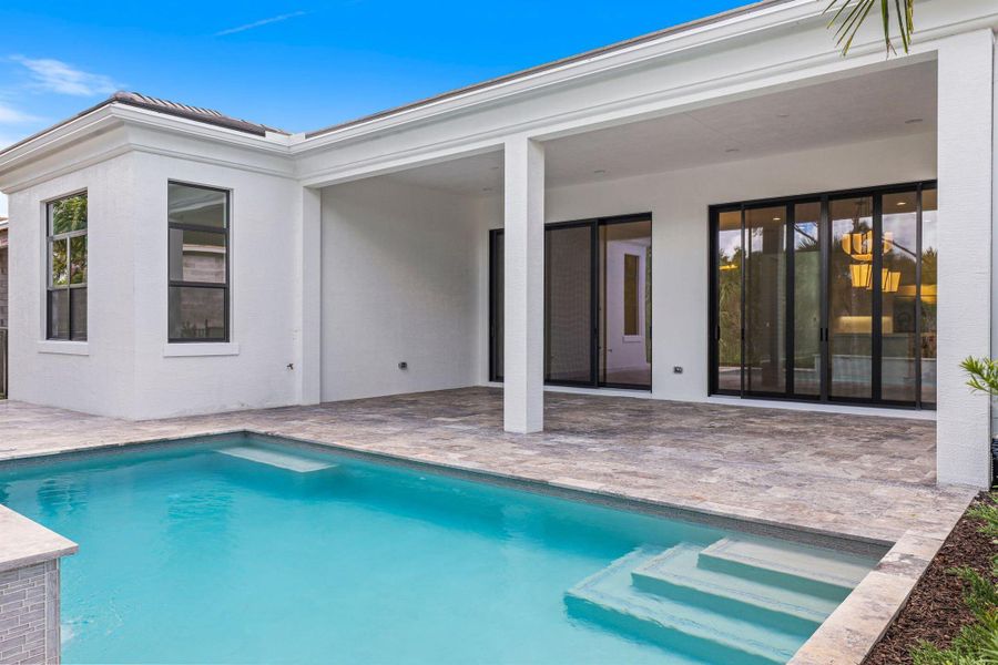 Exterior details and patio area of a home in Artistry Palm Beach, Palm Beach Gardens (Image 21).