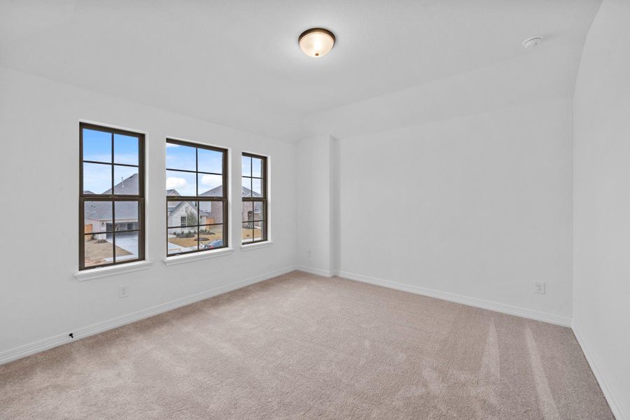 An inviting secondary bedroom that feels familiar, comfortable, and ready to make your own.