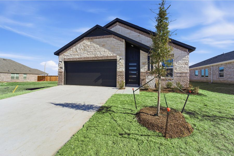Front exterior of a new home in Pebblebrook, Sherman, TX, highlighting curb appeal (Image 26).