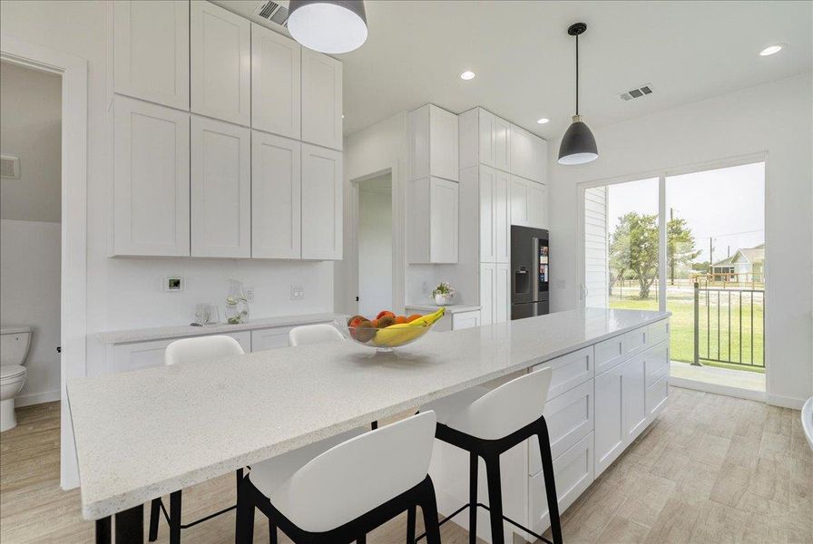 Open kitchen with eat in countertop Open kitchen with eat in countertop