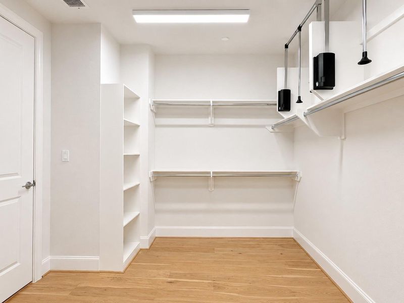Spacious walk-in closet in the primary suite.