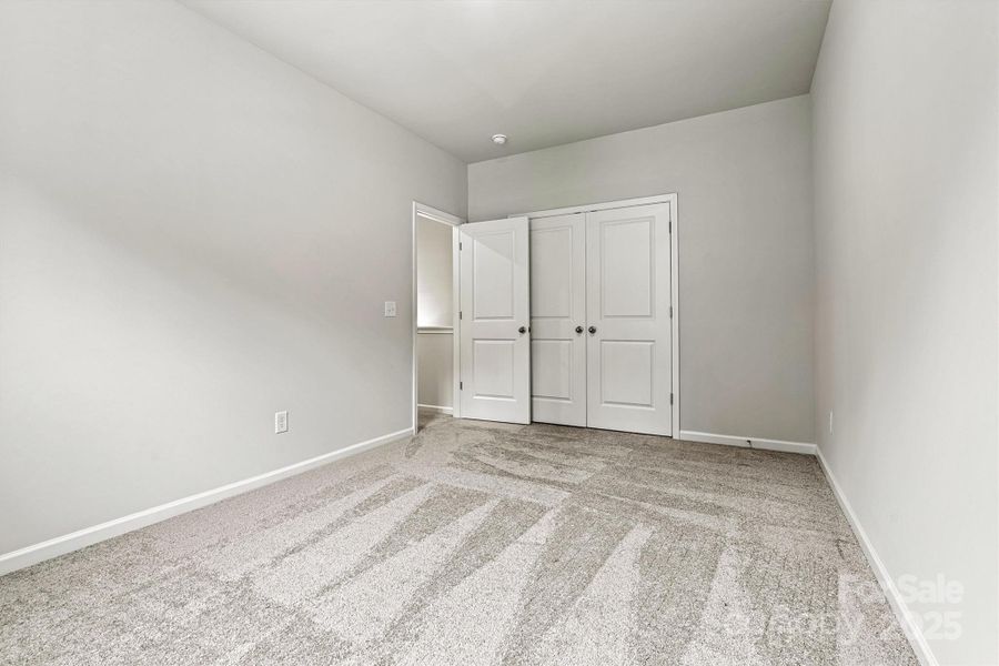 The two secondary bedrooms offer generous space, abundant natural light, and large closets—perfect for family, guests, or creating a personalized retreat. The two secondary bedrooms offer generous space, abundant natural light, and large closets—perfect for family, guests, or creating a personalized retreat.