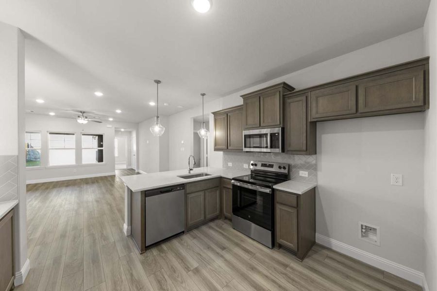 Furnished interior view inside a new home in Keeneland, Aubrey (Image 6). Furnished interior view inside a new home in Keeneland, Aubrey (Image 6).