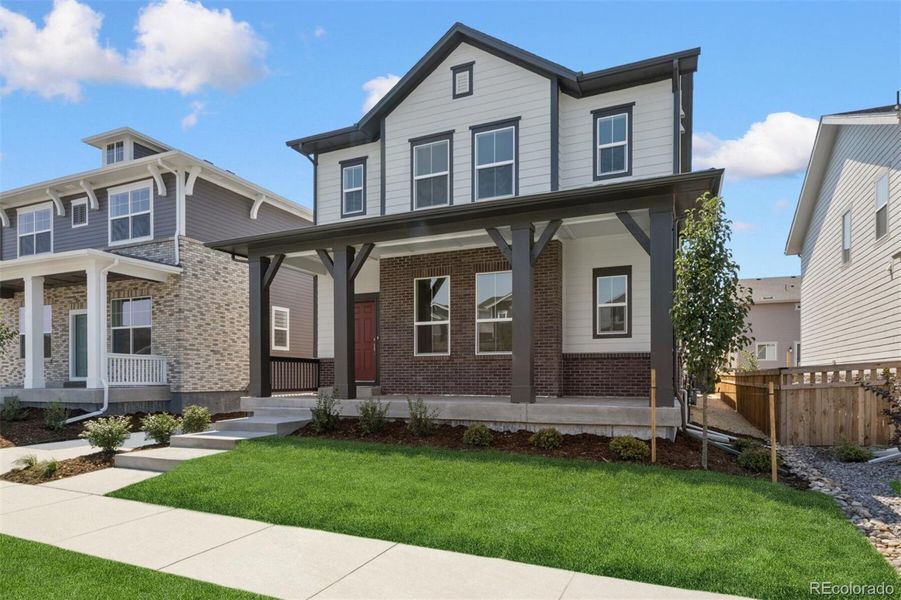 Front exterior of a new home in Painted Prairie Cottage, Aurora, CO, highlighting curb appeal (Image 25).