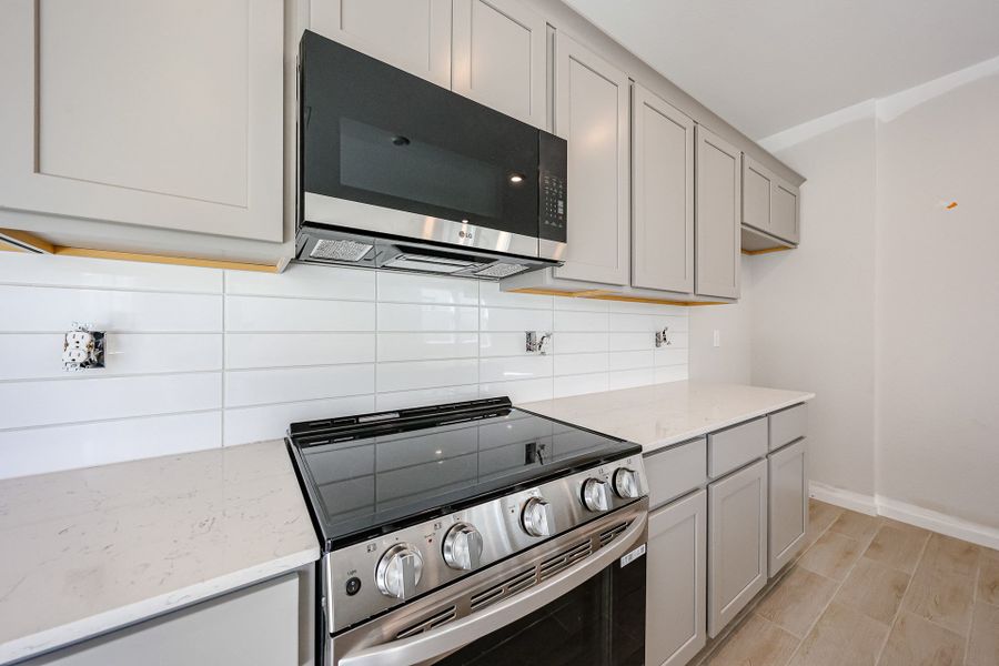 A kitchen with white cabinets. A kitchen with white cabinets.