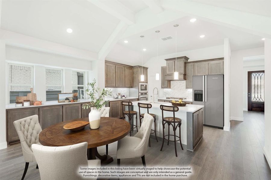 Open-concept kitchen and dining area with brown cabinets, center island, and round wood dining table on hardwood floors Open-concept kitchen and dining area with brown cabinets, center island, and round wood dining table on hardwood floors