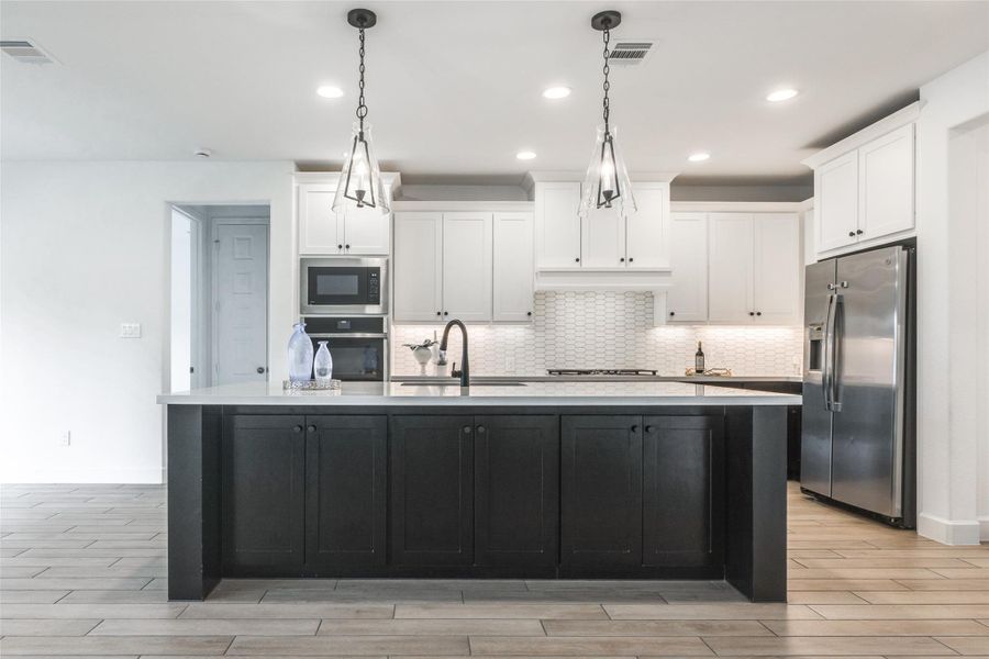 Enjoy entertaining with family and Friends around this large quartz island with sink & storage