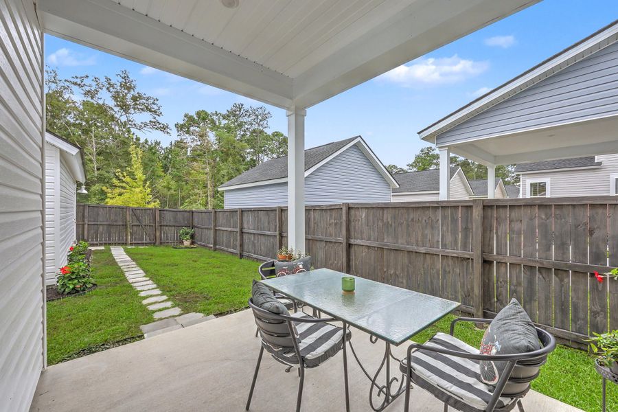 Exterior details and patio area of a home in Limehouse Village: Row Collection, Summerville (Image 31).