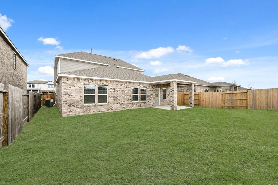 Exterior details and patio area of a home in Sunterra, Katy (Image 22).