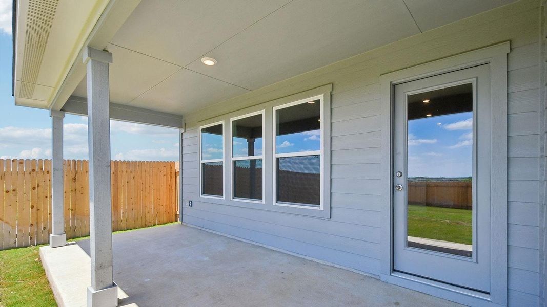 Exterior details and patio area of a home in Carillon, Manor (Image 16).