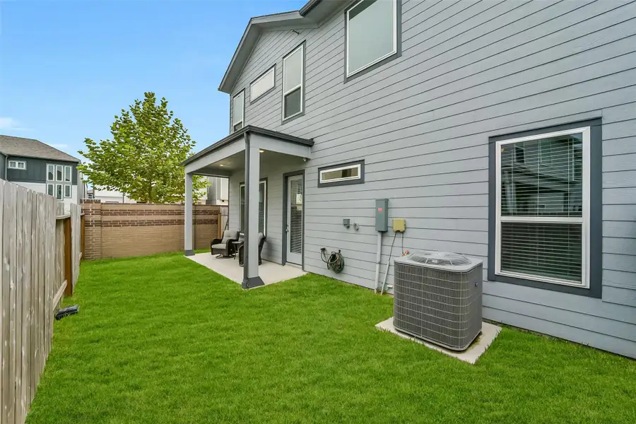 Exterior details and patio area of a home in , Houston (Image 24).
