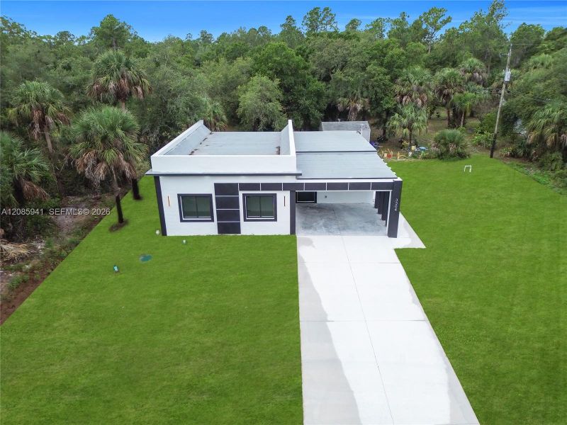 Front exterior of a new home in , Lehigh Acres, FL, highlighting curb appeal (Image 1). Front exterior of a new home in , Lehigh Acres, FL, highlighting curb appeal (Image 1).