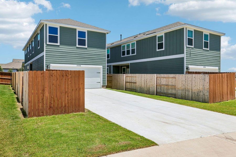 Front exterior of a new home in Avery Centre, Round Rock, TX, highlighting curb appeal (Image 2). Front exterior of a new home in Avery Centre, Round Rock, TX, highlighting curb appeal (Image 2).