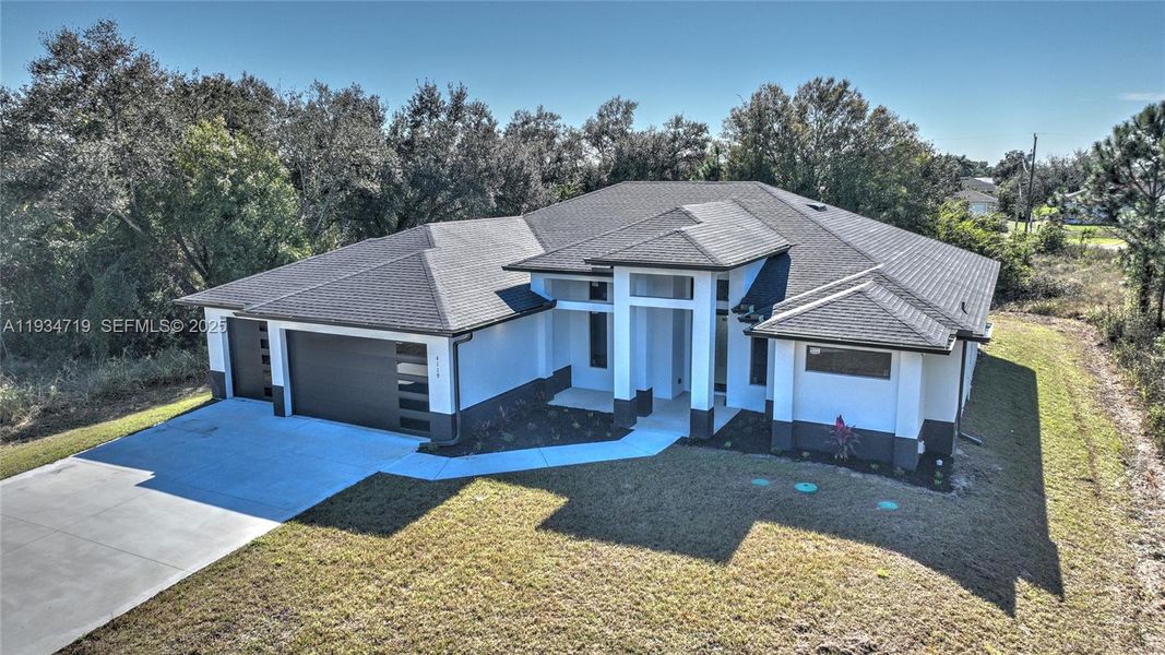 Front exterior of a new home in , Lehigh Acres, FL, highlighting curb appeal (Image 34).
