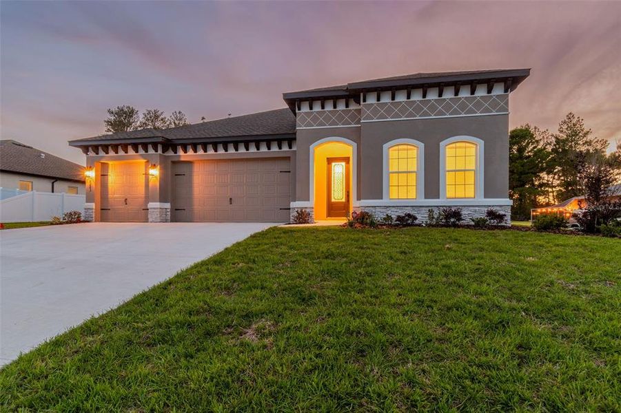 Front exterior of a new home in Royal Highlands, Spring Hill, FL, highlighting curb appeal (Image 25).