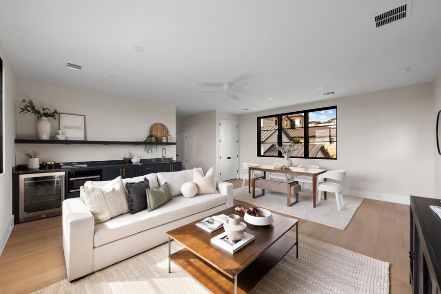 This versatile upper-level retreat is perfect as a secondary lounge, media room, or private guest living room