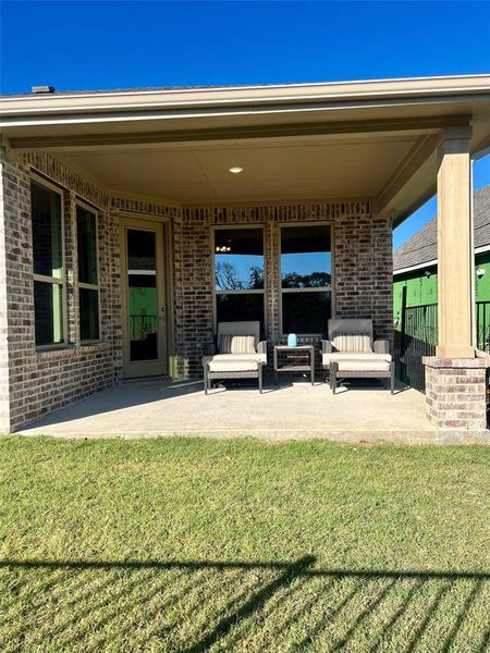 Nice enclosed back patio onlooking pond view.