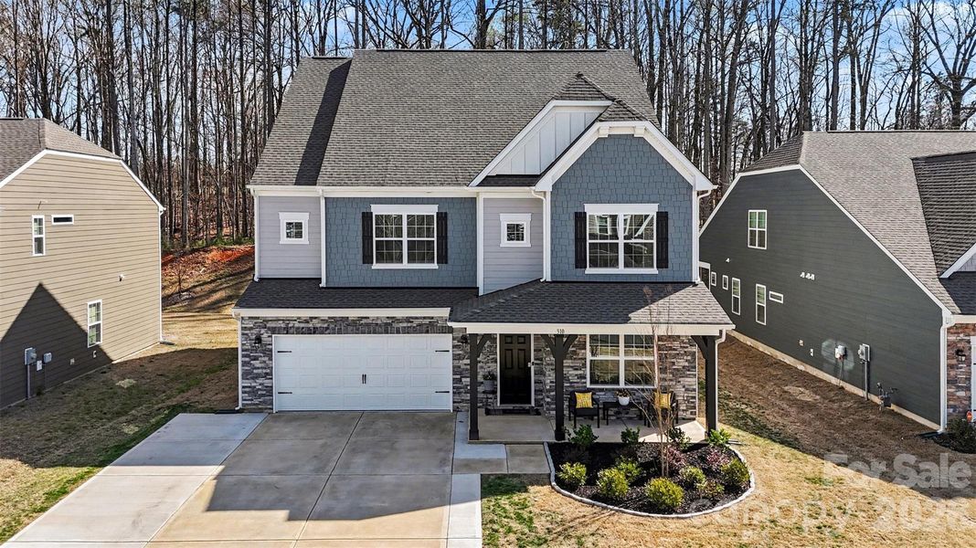 Front exterior of a new home in Falls Cove at Lake Norman, Troutman, NC, highlighting curb appeal (Image 23).