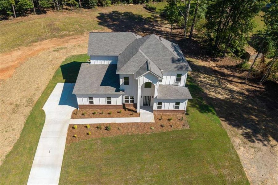Front exterior of a new home in , Snellville, GA, highlighting curb appeal (Image 20).