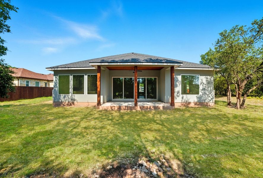 Back of house featuring a patio, roof with shingles, and ceiling fan Back of house featuring a patio, roof with shingles, and ceiling fan