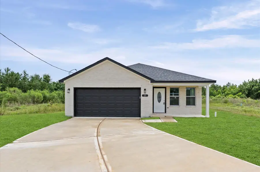 Front exterior of a new home in , Cleveland, TX, highlighting curb appeal (Image 1). Front exterior of a new home in , Cleveland, TX, highlighting curb appeal (Image 1).