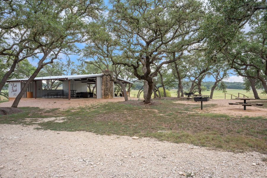 View of yard featuring an outdoor structure and an outbuilding View of yard featuring an outdoor structure and an outbuilding