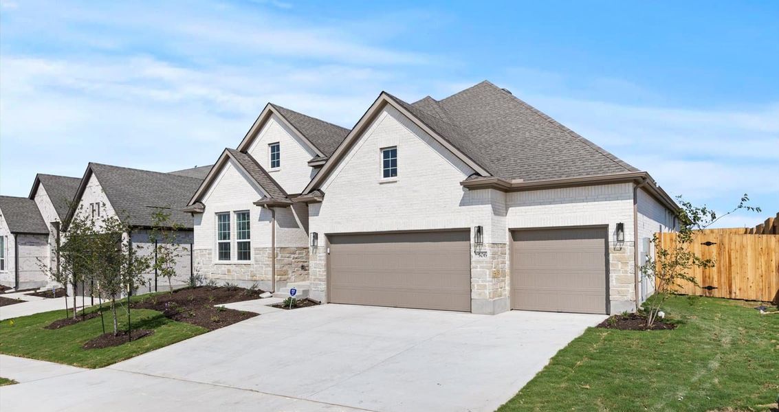 Representative exterior photo of a completed home built from the Wyatt by Chesmar Homes in Sunfield, Buda, TX (Image 2).