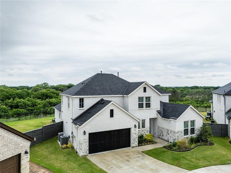 Front exterior of a new home in , Little Elm, TX, highlighting curb appeal (Image 23).