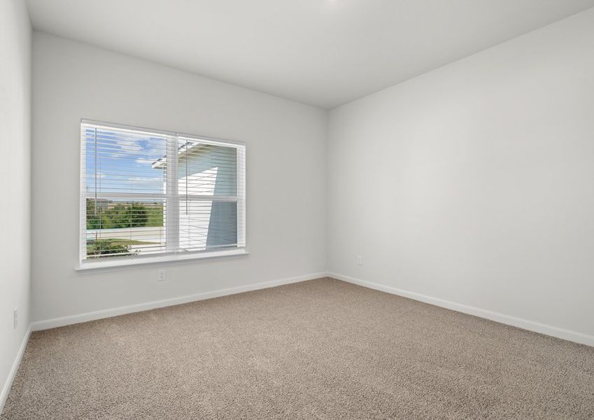 The master bedroom is large and has a great windows.