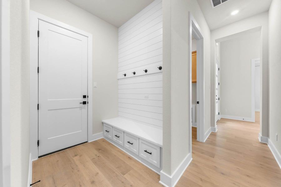 With thoughtful touches like a mudroom off the two-car garage and a conveniently located laundry room, this home is as practical as it is beautiful. With thoughtful touches like a mudroom off the two-car garage and a conveniently located laundry room, this home is as practical as it is beautiful.