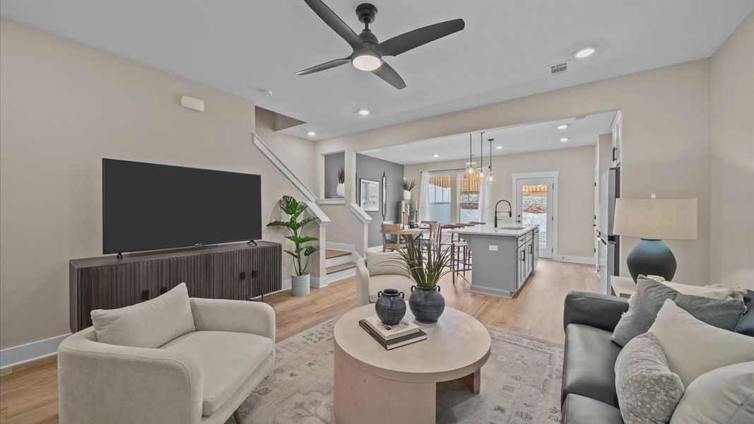 Exceptional family room with hardwood flooring in this exclusive DRB Homes townhome