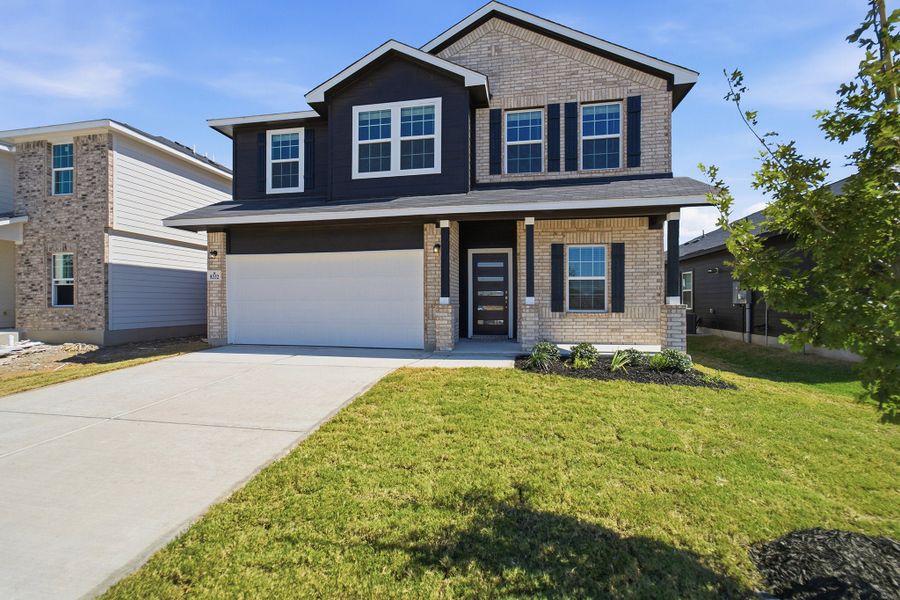 Front exterior of a new home in Red Hawk Landing, San Antonio, TX, highlighting curb appeal (Image 2).