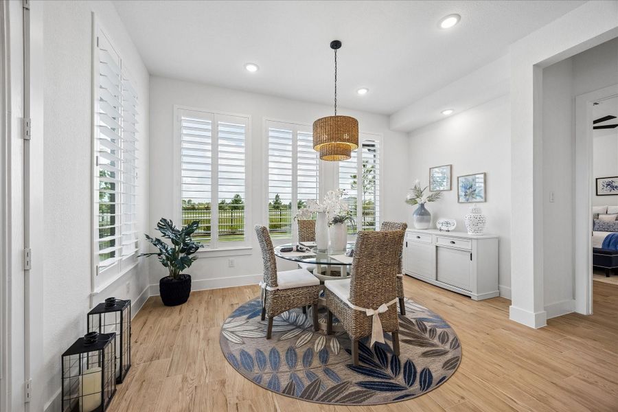 The dining room, located just off the kitchen, offers generous space for entertaining, direct access to the outdoor patio, and beautiful scenic views.