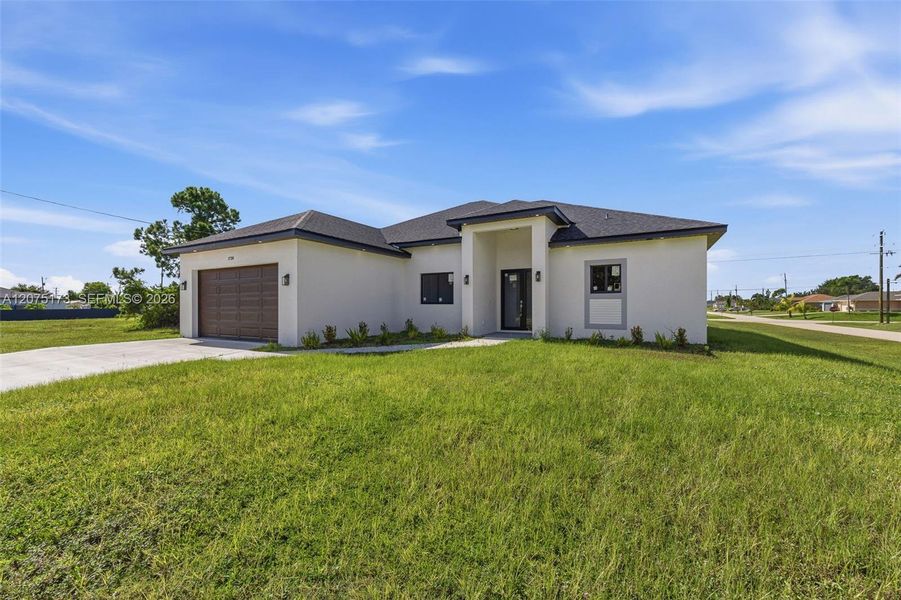 Front exterior of a new home in , Cape Coral, FL, highlighting curb appeal (Image 24).