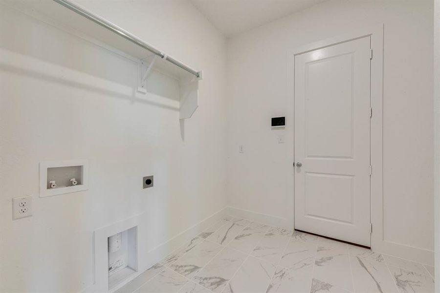 Laundry area with hookup for an electric dryer, light marble finish floors, and hookup for a washing machine Laundry area with hookup for an electric dryer, light marble finish floors, and hookup for a washing machine