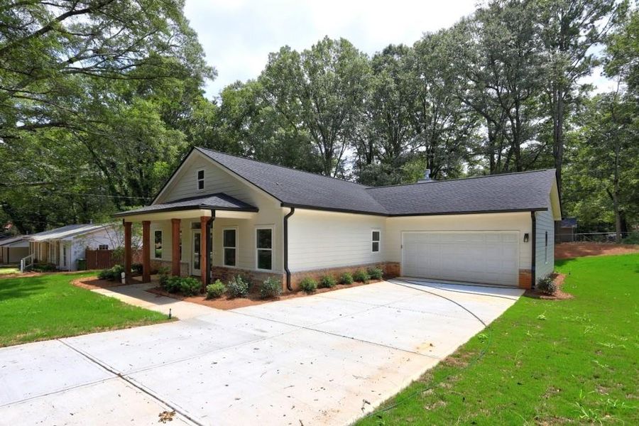 Front exterior of a new home in , Monroe, GA, highlighting curb appeal (Image 23).
