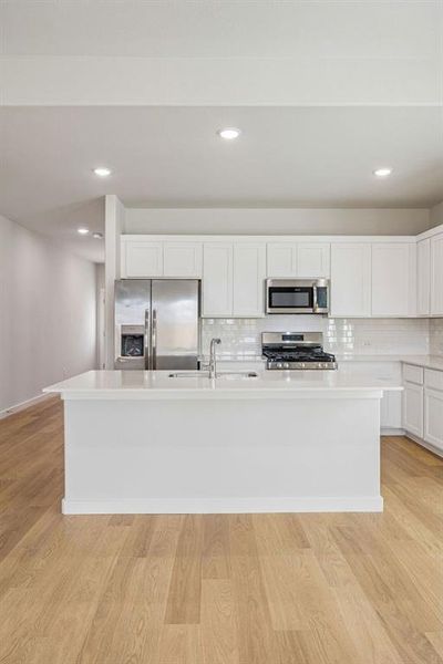 Kitchen in the Stanley II home plan by Trophy Signature Homes – REPRESENTATIVE PHOTO