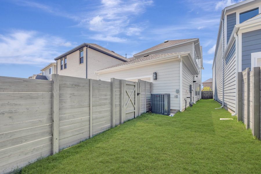 Exterior details and patio area of a home in The Retreat at Harvest, Argyle (Image 3).